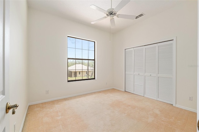 9180 SW 202nd Avenue Rd, Dunnellon, FL 34431 - unfurnished bedroom with carpet, a closet, and ceiling fan