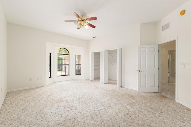9180 SW 202nd Avenue Rd, Dunnellon, FL 34431 - unfurnished bedroom featuring light colored carpet and ceiling fan