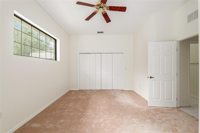 9180 SW 202nd Avenue Rd, Dunnellon, FL 34431 - unfurnished bedroom featuring carpet floors, a closet, and a ceiling fan