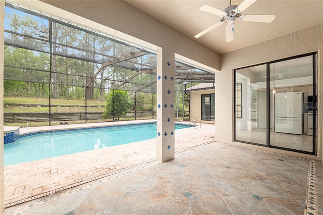 9180 SW 202nd Avenue Rd, Dunnellon, FL 34431 - swimming pool featuring ceiling fan, a patio, and glass enclosure
