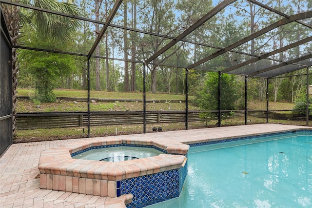 9180 SW 202nd Avenue Rd, Dunnellon, FL 34431 - view of swimming pool featuring glass enclosure and a pool with connected hot tub