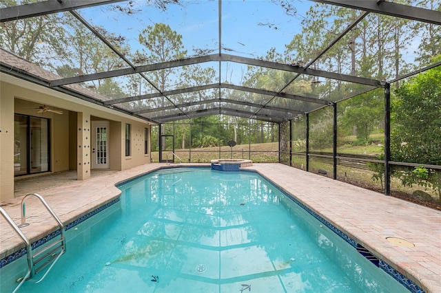 9180 SW 202nd Avenue Rd, Dunnellon, FL 34431 - view of pool with a pool with connected hot tub, a patio area, ceiling fan, and glass enclosure