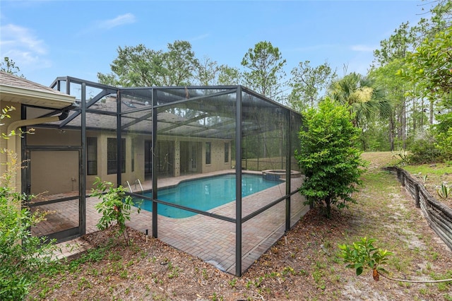 9180 SW 202nd Avenue Rd, Dunnellon, FL 34431 - outdoor pool with a patio area and glass enclosure