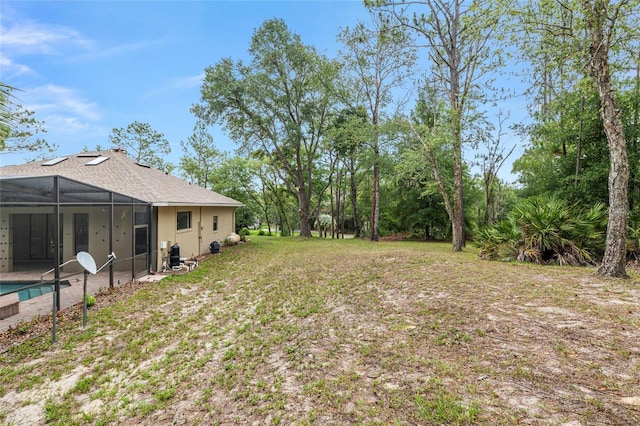 9180 SW 202nd Avenue Rd, Dunnellon, FL 34431 - view of yard featuring glass enclosure and an outdoor pool