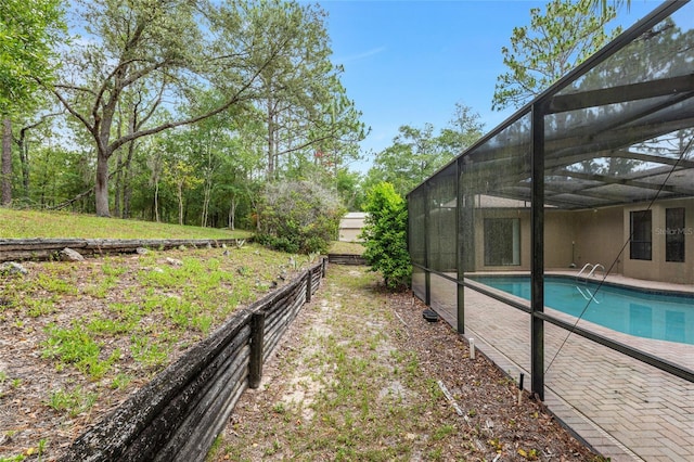 9180 SW 202nd Avenue Rd, Dunnellon, FL 34431 - view of yard with an outdoor pool, a lanai, and a patio area