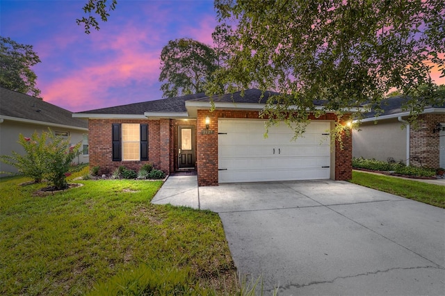 2127 NE 38th Ter, Ocala, FL 34470 - ranch-style home featuring brick siding, a garage, concrete driveway, and a front yard