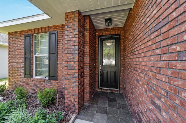 2127 NE 38th Ter, Ocala, FL 34470 - doorway to property featuring brick siding and a porch