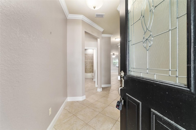 2127 NE 38th Ter, Ocala, FL 34470 - foyer entrance featuring ornamental molding, light tile patterned floors, and a textured wall