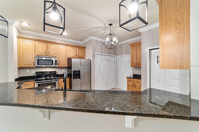 2127 NE 38th Ter, Ocala, FL 34470 - kitchen featuring stainless steel appliances, ornamental molding, a chandelier, dark stone countertops, and a peninsula