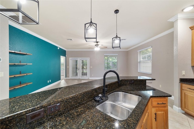 2127 NE 38th Ter, Ocala, FL 34470 - kitchen featuring ornamental molding, french doors, open floor plan, ceiling fan, and decorative light fixtures