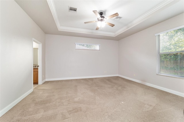 2127 NE 38th Ter, Ocala, FL 34470 - spare room featuring light colored carpet, a raised ceiling, ceiling fan, and crown molding