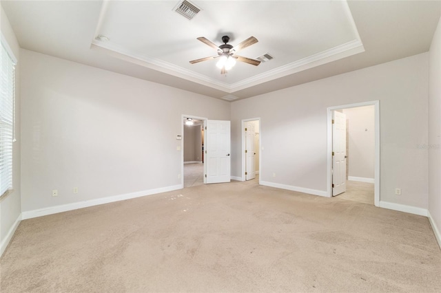 2127 NE 38th Ter, Ocala, FL 34470 - unfurnished bedroom with a raised ceiling, ornamental molding, light carpet, and ceiling fan