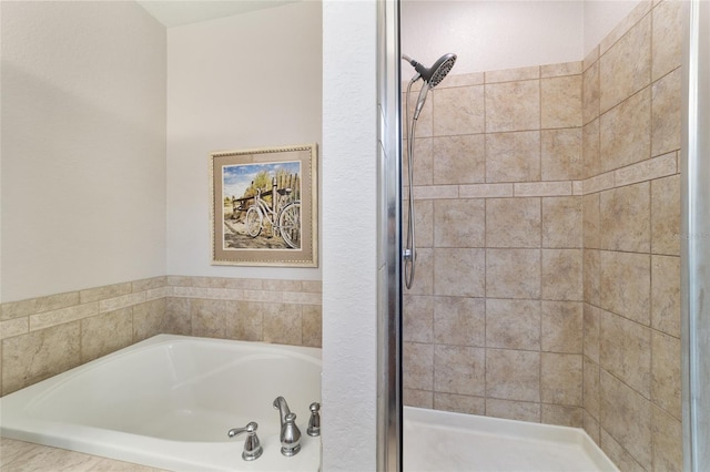 2127 NE 38th Ter, Ocala, FL 34470 - bathroom featuring a shower stall and a garden tub
