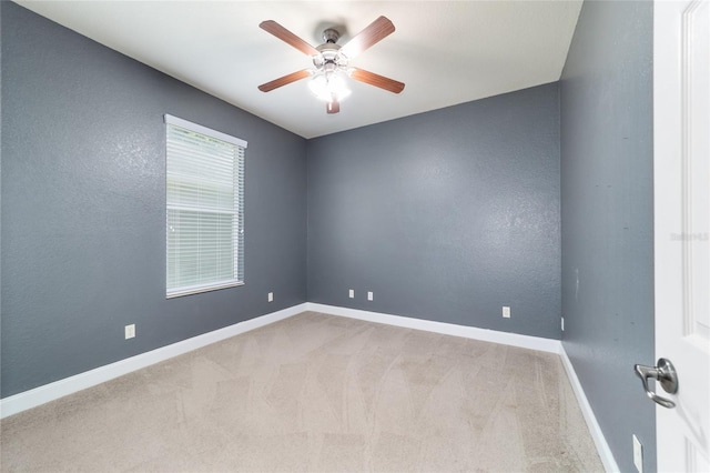 2127 NE 38th Ter, Ocala, FL 34470 - empty room featuring ceiling fan and carpet