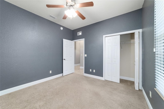 2127 NE 38th Ter, Ocala, FL 34470 - unfurnished bedroom featuring carpet floors, a closet, ceiling fan, and a textured wall