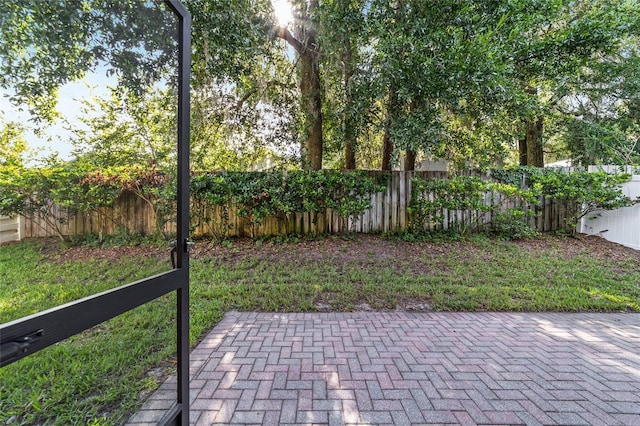 2127 NE 38th Ter, Ocala, FL 34470 - fenced backyard with a patio