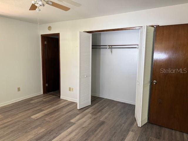 4701 NE 9th St, Ocala, FL 34470 - unfurnished bedroom with wood finished floors, a closet, and a ceiling fan