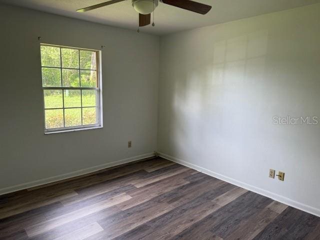 4701 NE 9th St, Ocala, FL 34470 - unfurnished room with a ceiling fan and dark wood-type flooring