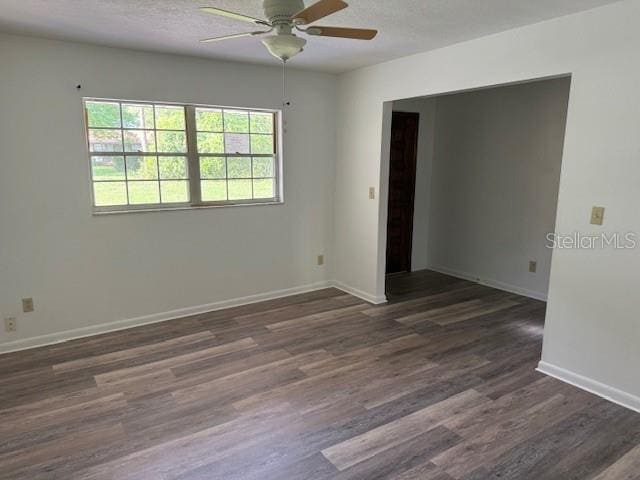 4701 NE 9th St, Ocala, FL 34470 - unfurnished room with a ceiling fan, dark wood-style floors, and a textured ceiling