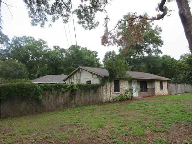6141 NW 64th Ct, Ocala, FL 34482 - back of house featuring stone siding