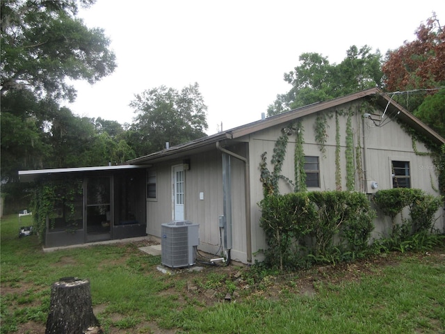 6141 NW 64th Ct, Ocala, FL 34482 - rear view of property featuring a sunroom