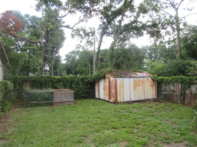 6141 NW 64th Ct, Ocala, FL 34482 - fenced backyard featuring a storage unit