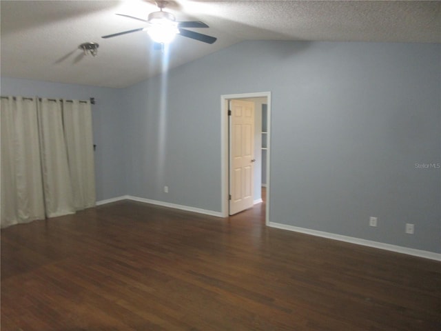 6141 NW 64th Ct, Ocala, FL 34482 - empty room with dark wood finished floors, ceiling fan, a textured ceiling, and lofted ceiling