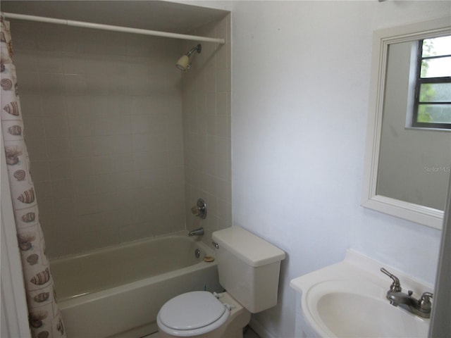 6141 NW 64th Ct, Ocala, FL 34482 - bathroom featuring a sink and shower / tub combo with curtain