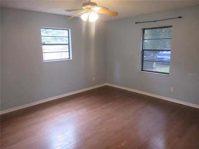6141 NW 64th Ct, Ocala, FL 34482 - unfurnished room featuring dark wood-style flooring and a ceiling fan
