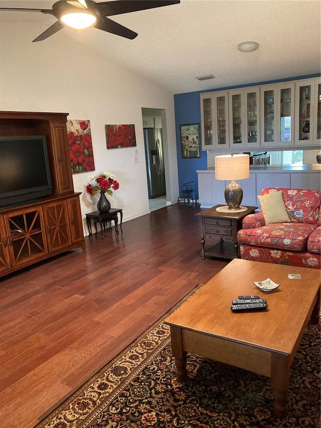 8450 SW 90th St Unit D, Ocala, FL 34481 - living room with ceiling fan, vaulted ceiling, wood finished floors, and a textured ceiling