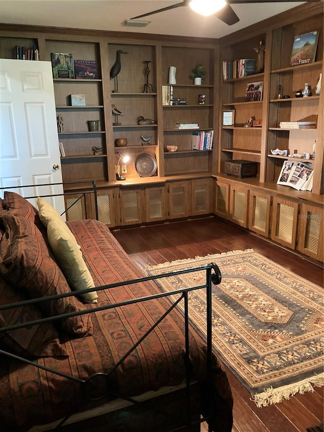 8450 SW 90th St Unit D, Ocala, FL 34481 - living room with dark wood finished floors, a ceiling fan, and built in features