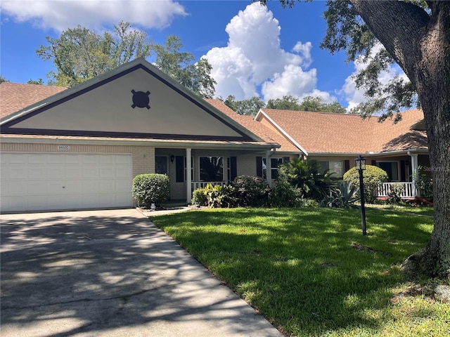8450 SW 90th St Unit D, Ocala, FL 34481 - ranch-style house featuring a front yard, a garage, brick siding, concrete driveway, and a shingled roof