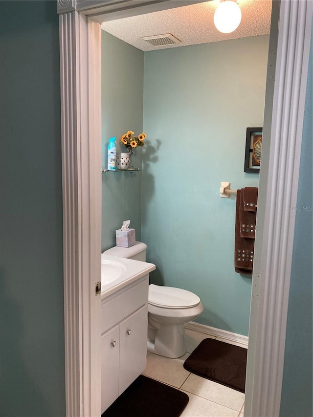 8450 SW 90th St Unit D, Ocala, FL 34481 - bathroom with vanity, tile patterned floors, and a textured ceiling