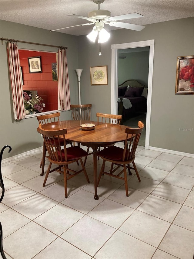 8450 SW 90th St Unit D, Ocala, FL 34481 - dining room featuring a textured ceiling, a ceiling fan, and light tile patterned floors