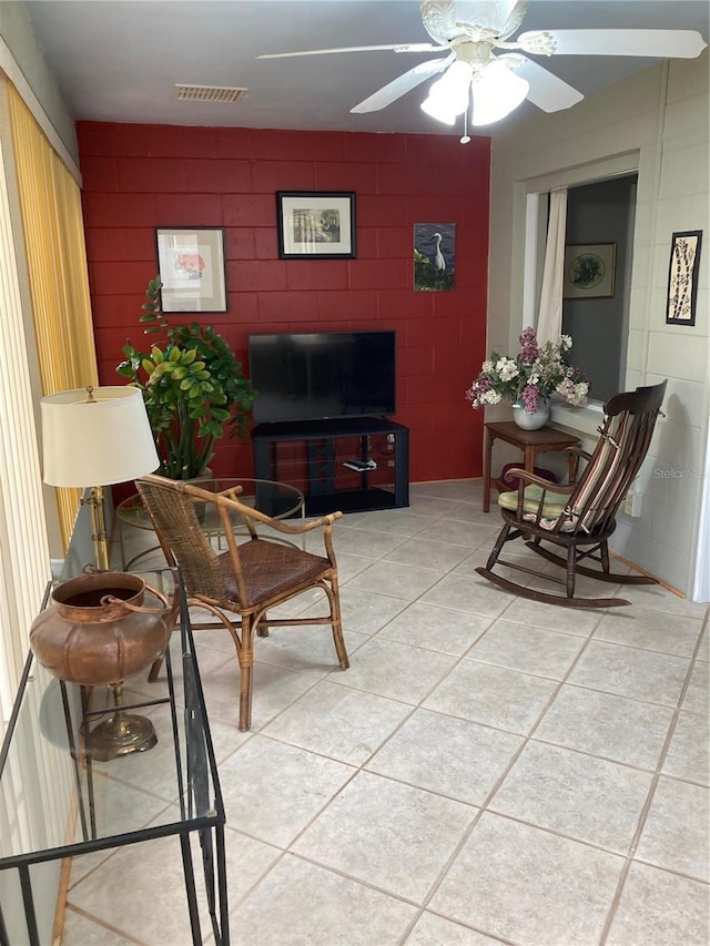 8450 SW 90th St Unit D, Ocala, FL 34481 - living room featuring light tile patterned flooring and ceiling fan