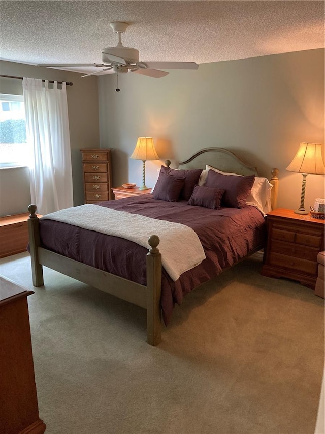 8450 SW 90th St Unit D, Ocala, FL 34481 - carpeted bedroom featuring a textured ceiling and a ceiling fan