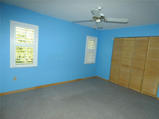 4622 N Pink Poppy Dr, Beverly Hills, FL 34465 - unfurnished bedroom with carpet floors, a closet, and ceiling fan