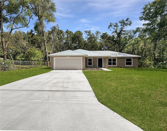 3679 E Bernice St, Inverness, FL 34453 - single story home with a garage, driveway, stucco siding, and a metal roof