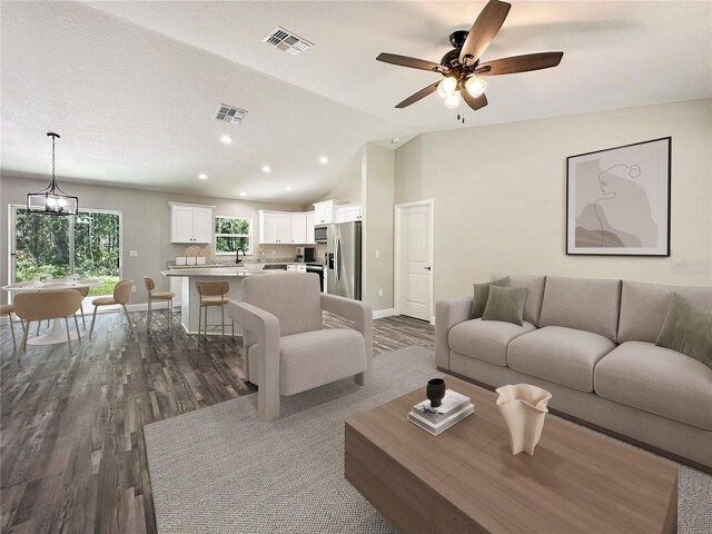 3679 E Bernice St, Inverness, FL 34453 - living room featuring dark wood-style floors, vaulted ceiling, ceiling fan, and recessed lighting