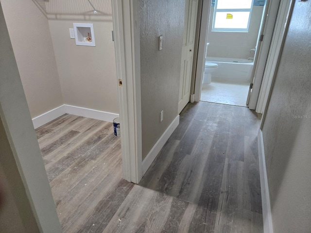 11139 N Sonnet Ter, Citrus Springs, FL 34433 - hall featuring wood finished floors and baseboards
