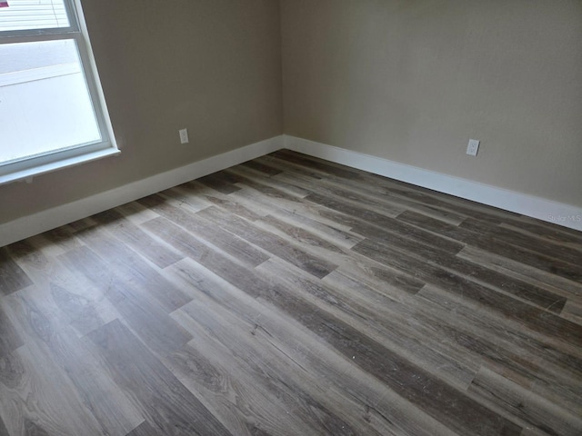 11139 N Sonnet Ter, Citrus Springs, FL 34433 - unfurnished room with healthy amount of natural light and dark wood-style floors