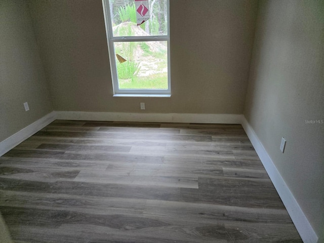 11139 N Sonnet Ter, Citrus Springs, FL 34433 - empty room with baseboards and wood finished floors