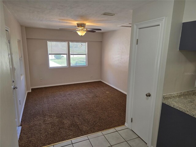 315 NE 2nd Ave, Williston, FL 32696 - empty room featuring a ceiling fan, light carpet, and light tile patterned floors