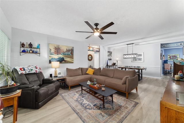 8841 SW 91st St Unit A, Ocala, FL 34481 - living area featuring a ceiling fan, light wood-style floors, and a textured ceiling