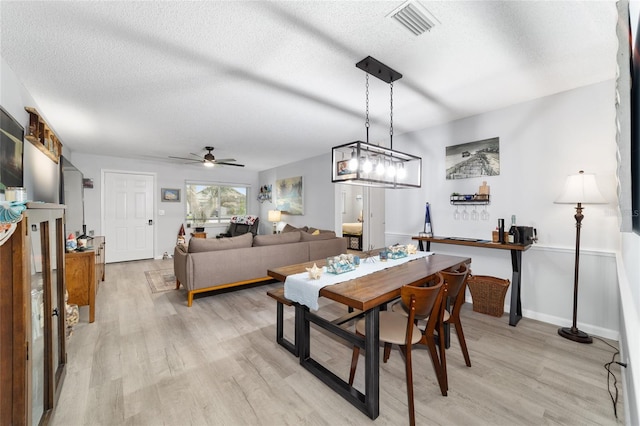 8841 SW 91st St Unit A, Ocala, FL 34481 - dining space featuring light wood-style flooring, ceiling fan, and a textured ceiling