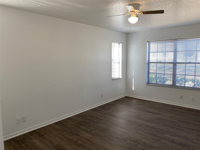 3381 NW 44th Ct, Ocala, FL 34482 - empty room with dark wood-style floors, a ceiling fan, and a textured ceiling