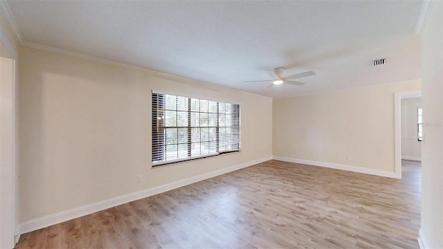 4121 SW 6th Ave, Ocala, FL 34471 - spare room with ornamental molding, plenty of natural light, light wood-style flooring, and a ceiling fan
