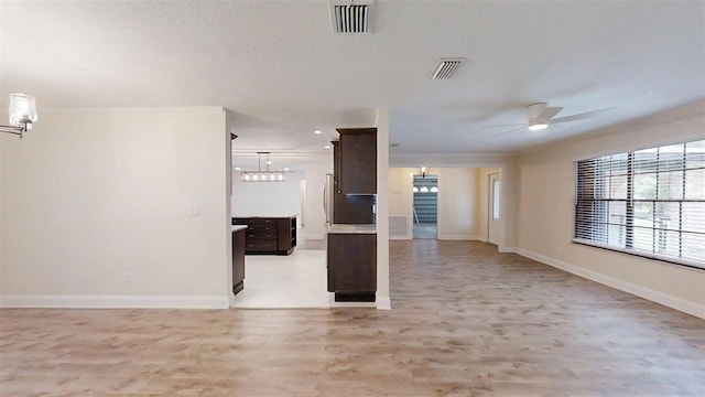 4121 SW 6th Ave, Ocala, FL 34471 - unfurnished living room featuring ceiling fan and light wood-style flooring