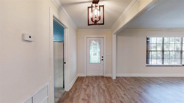 4121 SW 6th Ave, Ocala, FL 34471 - foyer featuring wood finished floors and crown molding