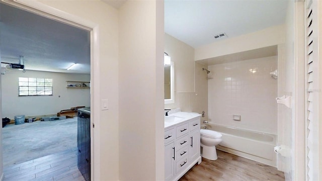 4121 SW 6th Ave, Ocala, FL 34471 - bathroom with vanity, wood finished floors, and shower / bath combination